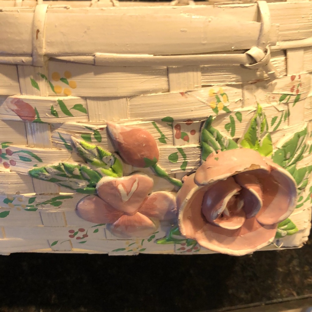 Decorated white wooden basket/w/ pink painted flowers/ green leaves.